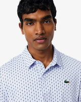 POLO LACOSTE PERFORMANCE PRINT CELESTE / BLANCO